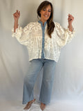 White batwing blouse (with denim and sequin detail)